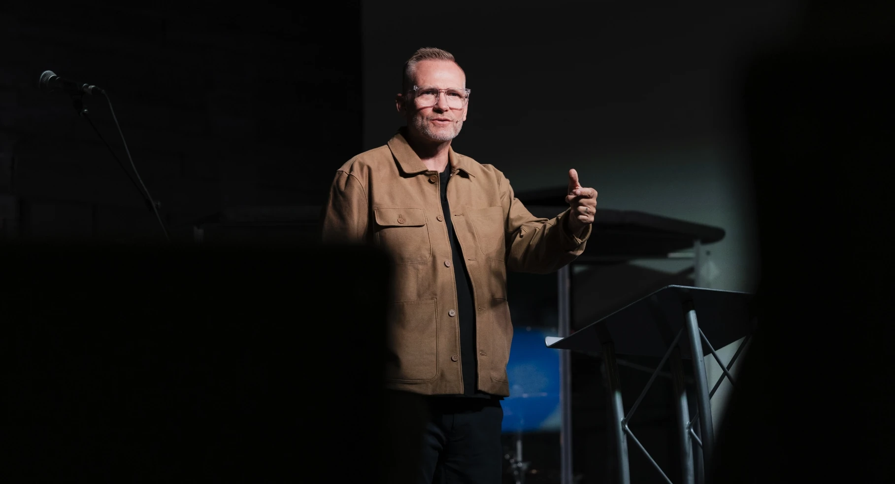 Mark Neal speaking from the stage