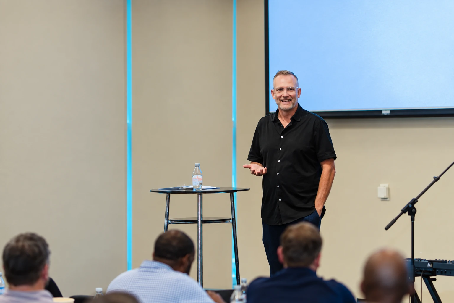 Mark Neal speaking to a leadership team in a workshop room